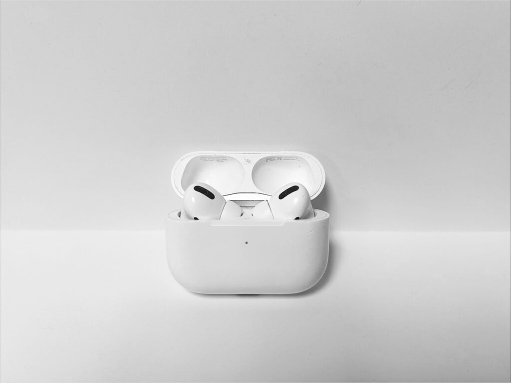 Photo of Apple AirPod pros with an open case and both headphones visible inside the case.